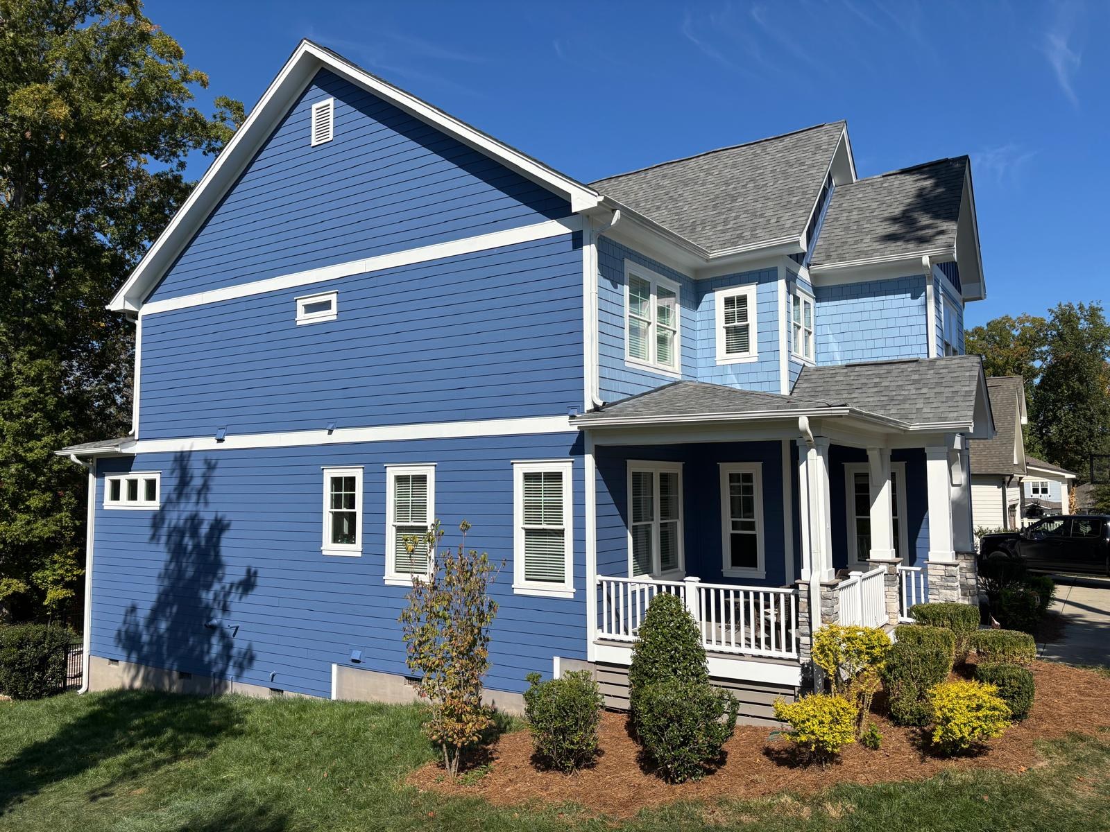 Blue home exterior with white trim